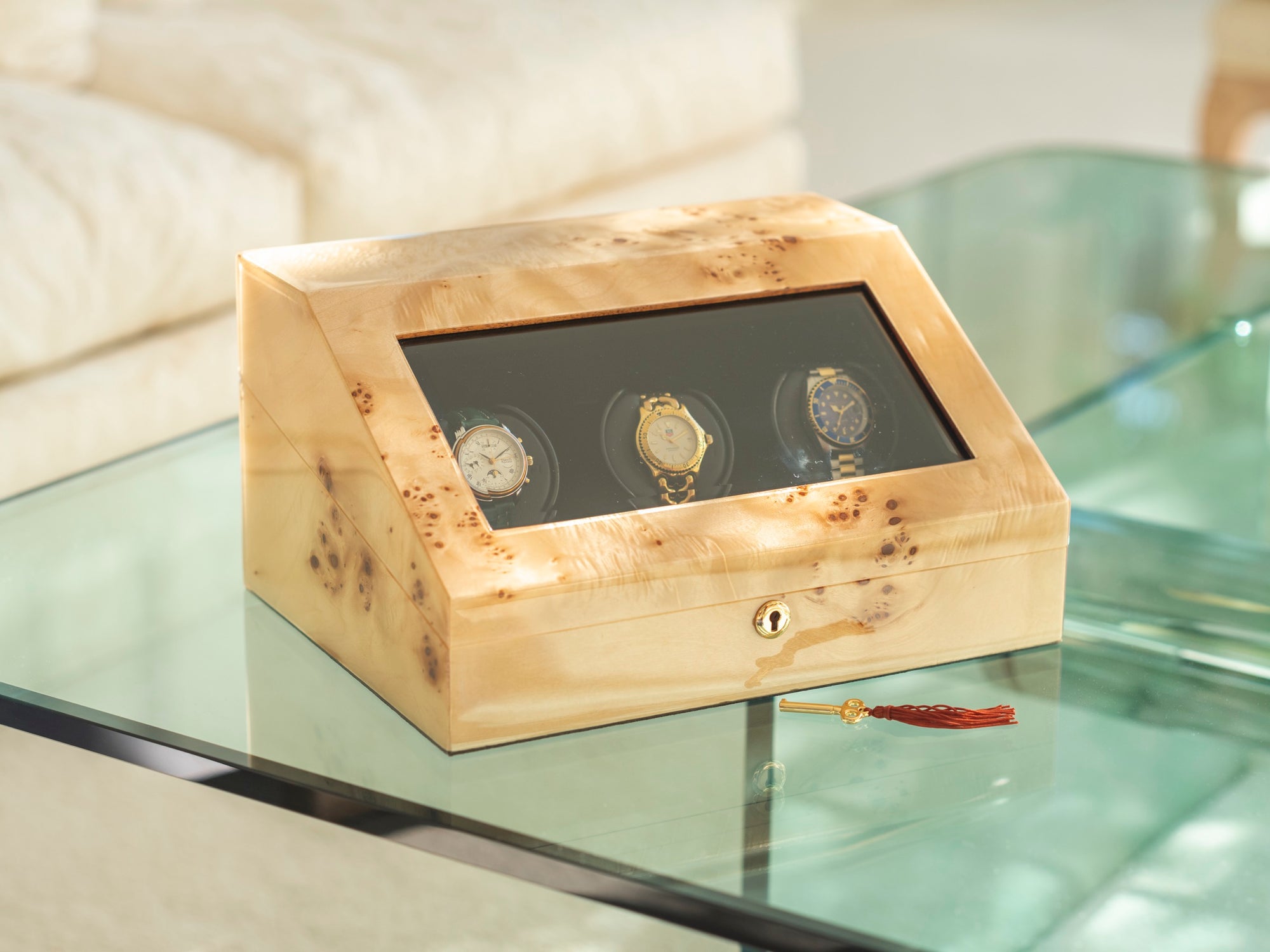 An Orbita burl-wood watch winder, hand-built in Wilmington, North Carolina